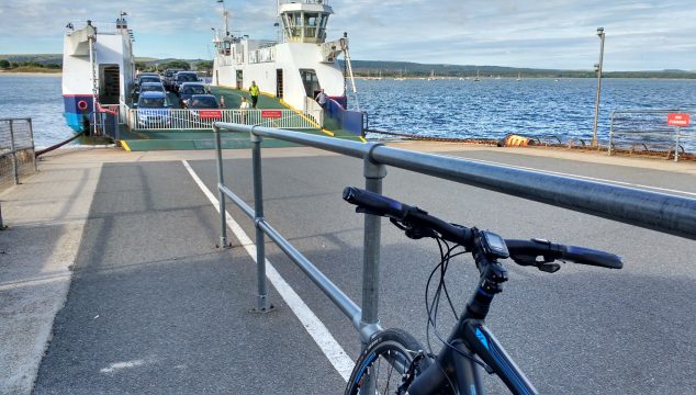 My bike on the quay with ferry approaching