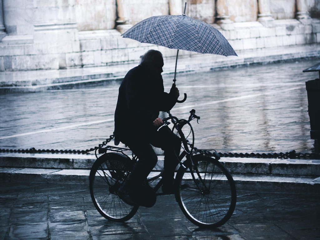 Cyclist with umbrella