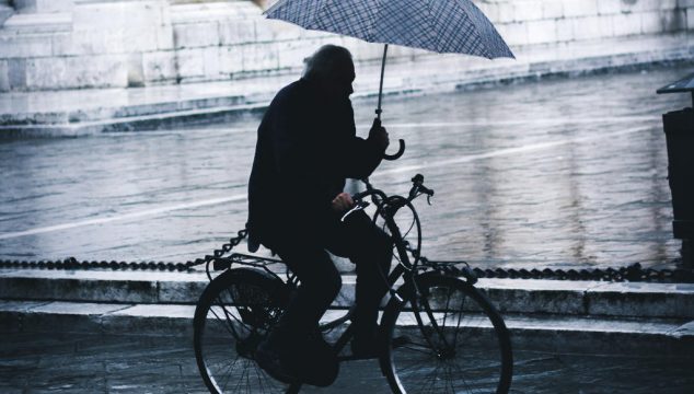 Cyclist with umbrella
