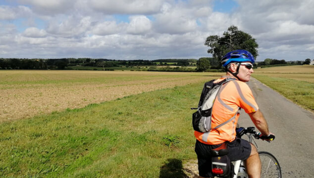 Countryside scene with cyclist Brian in foreground