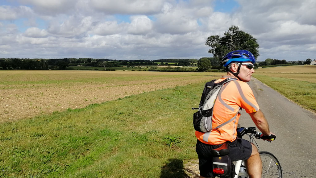 Countryside scene with cyclist Brian in foreground